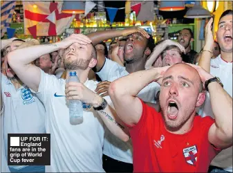  ??  ?? ■UP FOR IT: England fans are in the grip of World Cup fever