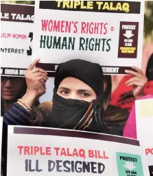  ??  ?? A Women India Movement activist protests against the Triple Talaq Bill at Parliament Street, in New Delhi, on Thursday