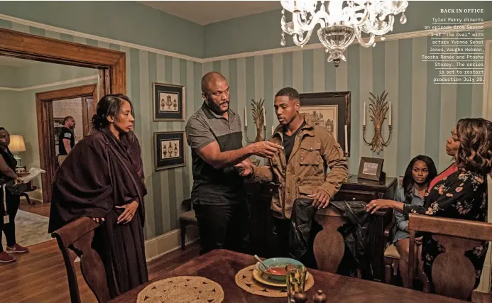  ??  ?? BACK IN OFFICE Tyler Perry directs an episode from Season 1 of “The Oval” with actors Yvonne Senat Jones,vaughn Hebron, Teesha Renée and Ptosha Storey. The series is set to restart production July 28.