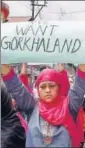  ?? PTI ?? A woman displays a placard with the demand for Gorkhaland state during a silent peace rally in Darjeeling on Sunday.