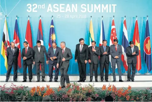  ?? AP ?? Asean leaders leave the stage after their group photo at the 32nd Asean Summit on April 28 in Singapore.