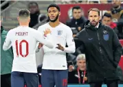  ??  ?? Troubled week: Raheem Sterling at training yesterday (right) after Joe Gomez was booed at Wembley (above)