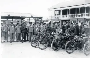  ?? ?? Riders and spectators, some in their blue hospital uniforms, outside the Brooklands clubhouse. [Hartley Collection – Brooklands Museum]