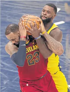  ?? AP ?? Cleveland’s LeBron James, left, vies for the ball with Indiana’s Lance Stephenson.