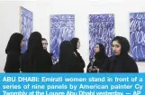  ??  ?? ABU DHABI: Emirati women stand in front of a series of nine panels by American painter Cy Twombly at the Louvre Abu Dhabi yesterday. — AP