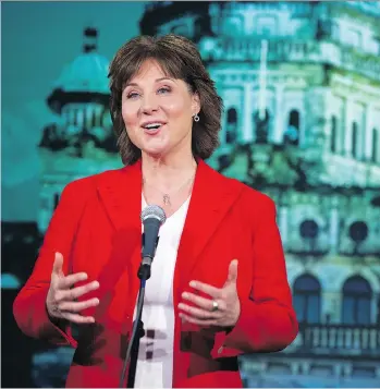  ?? GERRY KAHRMANN ?? Liberal Leader Christy Clark, seen answering a question from the media after the televised leaders debate in Vancouver on Wednesday, says trade deals aren’t negotiated “by losing your temper.”