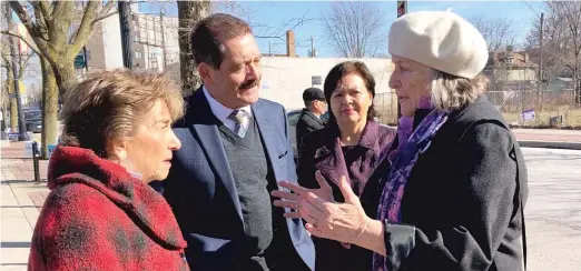  ?? LYNN SWEET/SUN-TIMES ?? Democratic Reps. Jan Schakowsky (left) and Jesus “Chuy” Garcia, a candidate for mayor, talk to community activist Katy Hogan Sunday outside an early voting site at 1610 W. Howard as Garcia’s wife, Evelyn Chinea-Garcia, looks on.