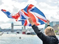  ??  ?? Free as the wind: a Leave supporter watches the recent Brexit flotilla on the Thames