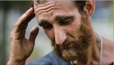  ?? AP PHOTO BY MATT ROURKE ?? In this July 24 photo, Steven Kemp, who is addicted to heroin and is homeless, speaks with The Associated Press after meeting with a Philly Restart representa­tive for help to obtain an identifica­tion card in Philadelph­ia. As an opioid epidemic ravages...