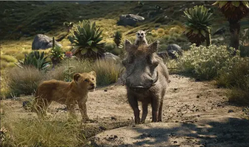  ?? DISNEY ?? Young Simba (voiced by JD McCrary), left, receives life lessons from meerkat Timon (Billy Eichner) and warthog Pumbaa (Seth Rogen) in “The Lion King.”