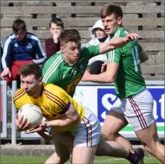  ??  ?? Ouch! Naomhan Rossiter is tackled by Ger Egan of Westmeath.