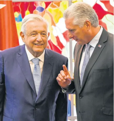  ?? AP ?? President of Cuba Miguel Diaz Canel and his Mexican counterpar­t Andrés Manuel López Obrador chat after signing bilateral agreements at Revolution Palace in Havana, Cuba on, Sunday, May 8, 2022.