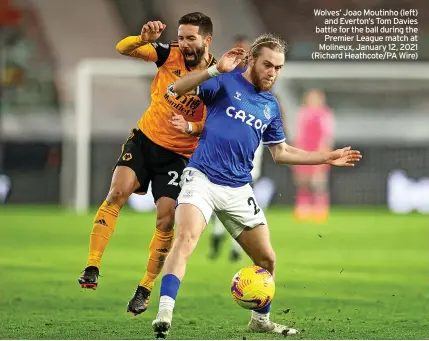  ?? ?? Wolves’ Joao Moutinho (left) and Everton’s Tom Davies battle for the ball during the Premier League match at Molineux, January 12, 2021 (Richard Heathcote/pa Wire)
