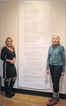  ?? SALLY COLE/THE GUARDIAN ?? Alanna Jankov, left, and Sarah Saunders, stand next to “Lower the Boom”, a poem by John MacKenzie. It honours the late Ivan Arsenault, a Miscouche native.