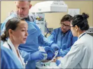  ?? COURTESY OF CAROLE GAN ?? Emergency personnel work on a patient during a drill at Lodi Memorial Hospital.