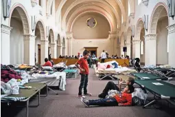  ??  ?? After being processed by immigratio­n authoritie­s, the Lopezes were left at a former monastery that is now a shelter in Tucson, Arizona. Caleb Lopez, 6, near left, with friends he made at the shelter.