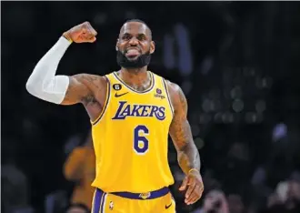  ?? AP PHOTO/JAE C. HONG ?? Los Angeles Lakers’ LeBron James flexes his arm during the second half of Monday’s game against the Houston Rockets in Los Angeles. The Lakers won 140-132.