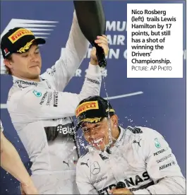  ?? PICTURE: AP PHOTO ?? Nico Rosberg (left) trails Lewis Hamilton by 17 points, but still has a shot of winning the Drivers’ Championsh­ip.