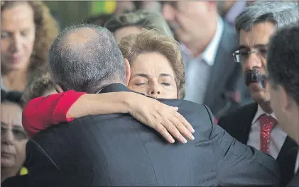  ?? AP PHOTO ?? Brazil’s ousted President Dilma Rousseff is embraced by former minister Aldo Rebelo, after she addressed supporters from the official residence of the president, Alvorada Palace in Brasilia, Brazil, Wednesday.