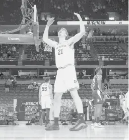  ?? JAMIE SQUIRE/GETTY ?? Michigan’s Franz Wagner celebrates in the final moments of Sunday’s game against Florida State at Bankers Life Fieldhouse in Indianapol­is, Indiana.