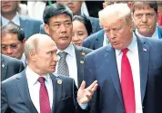  ?? MIKHAIL KLIMENTYEV — SPUTNIK, KREMLIN POOL PHOTO VIA AP ?? President Donald Trump, and Russia President Vladimir Putin met publicly in November at the APEC Summit.