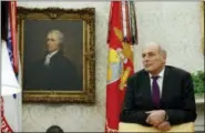  ?? AP PHOTO/EVAN VUCCI ?? White House Chief of Staff John Kelly watches as President Donald Trump speaks during a signing ceremony for the “Cybersecur­ity and Infrastruc­ture Security Agency Act” in the Oval Office of the White House on Friday.