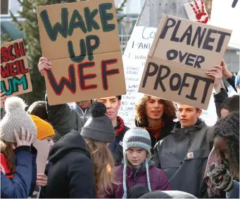  ??  ?? SWEDISH CLIMATE change activist Greta Thunberg (center) takes part in a climate strike protest during the 50th World Economic Forum annual meeting in Davos, Switzerlan­d, January 24.