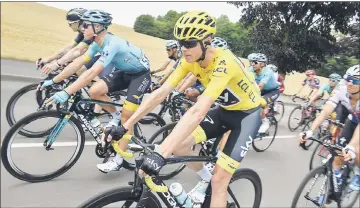  ??  ?? Great Britain’s Christophe­r Froome, wearing the overall leader’s yellow jersey, rides during the 213.5 km seventh stage of the 104th edition of the Tour de France. — AFP photo