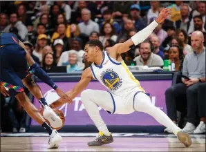  ?? NHAT V. MEYER/BAY AREA NEWS GROUP ?? The Warriors' Jordan Poole (3) fights for a loose ball against the Nuggets' Will Barton (5) during Game 4 in Denver, Colo., on Sunday.