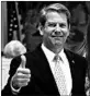 ?? JOHN BAZEMORE/AP ?? Candidate Brian Kemp gives a thumbs-up after voting in Wintervill­e, Ga.