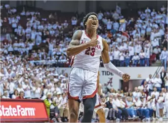  ?? AP PHOTO/VASHA HUNT ?? Alabama forward Nick Pringle celebrates after a dunk during Saturday’s home win against Arkansas.