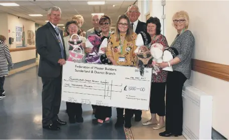  ??  ?? The Sunderland Federation of Master Builders present a cheque to the Cancer Informatio­n and Support Centre at Sunderland Royal Hospital.