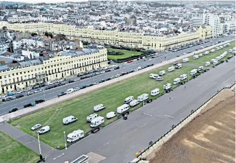  ??  ?? Caravans and motor homes on Hove Lawns in East Sussex yesterday