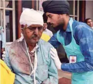  ?? AFPPIX ?? An injured passenger is treated at a hospital in Kanpur yesterday.