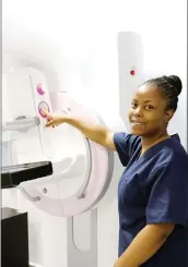  ?? ?? Radiograph­er Ayanda Masina illustrati­ngn how the Mammogram machine works.