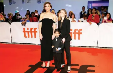  ??  ?? Director Sara Colangelo (right), actors Parker Sevak (front) and Maggie Gyllenhaal arrive for the premiere of ‘The Kindergart­en Teacher’ at the Toronto Internatio­nal Film Festival on Thursday. — Reuters photo