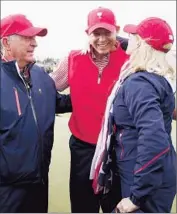  ?? Scott Halleran
Getty Images ?? CAPTAIN JAY HAAS and son Bill Haas celebrate their American team’s win in the Presidents Cup with Jay Haas’ wife, Jan.