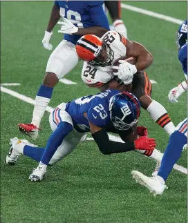  ?? RICH HUNDLEY III — FOR THE TRENTONIAN ?? Giants defensive back Logan Ryan (23) tackles Browns running back Nick Chubb (24) during Sunday night’s game at MetLife Stadium.