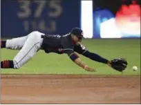  ?? FRANK GUNN — CANADIAN PRESS ?? Francisco Lindor dives but can’t make the play on a single by the Blue Jays’ Ezequiel Carrera during the first inning May 9 in Toronto.