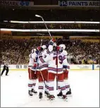  ?? Kirk Irwin / Getty Images ?? The Rangers’ celebrate Chris Kreider’s winning goal during the third period in Game 6 of a first-round playoff series against the Pittsburgh Penguins on Friday.
