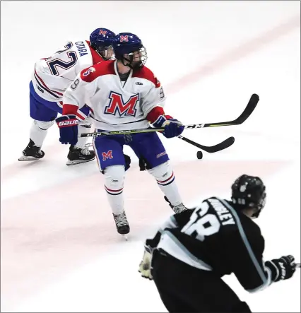  ?? Photos by Ernest A. Brown ?? Mount St. Charles Academy 18U forward Victor Czerneckia­nair (9, above) and Michael Citara (22, above) scored goals to help the Mounties win their first game at Adelard Arena, 3-1, Saturday. Cumberland’s Alex Pratt (14, below) attempts to get control of the puck.