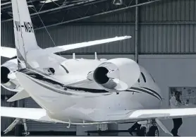  ?? Photo: Fairfax NZ
Special Correspond­ent ?? Members of the Exclusive Brethren stand beside the private jet belonging to Elect Vessel Bruce Hales, in Nelson in 2007.