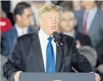  ?? LUIS ALVAREZ/AP ?? President Donald Trump speaks to a Venezuelan-American community at Florida Internatio­nal University in Miami on Monday.