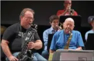  ??  ?? West Chester University jazz ensemble alumni, George Grund and Bob Fanelli, rehearse Wednesday morning. Grund graduated from WCU in 1975 and lives in Allentown, while Fanelli is a graduate of the Class of 1960 and lives in Newtown Square.