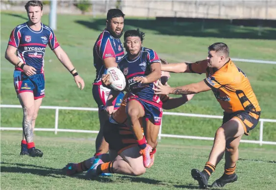  ??  ?? Runaway Bay’s Tyler Han tries to skip past the Southport defence in their RLGC pre-season clash. Picture: Mike Batterham