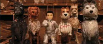  ?? FOX SEARCHLIGH­T VIA AP ?? Characters, from left, Chief, voiced by Bryan Cranston, King, voiced by Bob Balaban, Atari Kobayashi, voiced Koyu Rankin, Boss, voiced by Bill Murray, Rex, voiced by Edward Norton, And Duke, voiced by Jeff Goldblum, in a scene from “Isle of Dogs.”