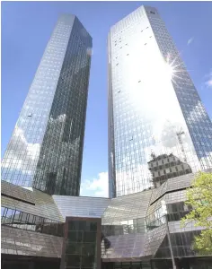  ??  ?? The towers of German Company Deutsche Bank are pictured in Frankfurt, Germany. Deutsche Bank has moved the clearing of a ‘large part’ of new euro-denominate­d derivative­s trades from London to Frankfurt, as financial firms ramp up their Brexit...