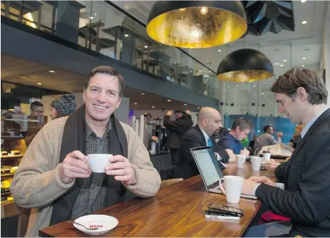  ?? JENELLE SCHNEIDER/PNG ?? John Neate, owner of JJ Bean in downtown Vancouver, says creating a ‘third space’ where people can relax and feel comfortabl­e is vital to success.