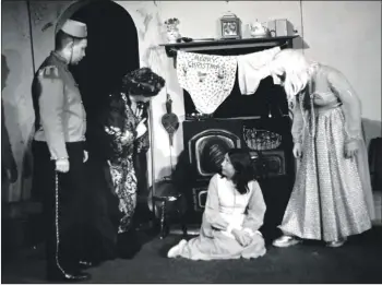  ?? 01_B50twe04 ?? Devilla and one of the Ugly Sisters (Tom Miller) gives Cinderella a hard time as Buttons looks on. The other Ugly Sister was played by Alan Little.