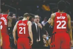  ?? The Associated Press ?? A VAGUE FUTURE: Toronto Raptors coach Nick Nurse, center, gathers his team during a timeout in the first half of a Jan. 8 basketball game against the Charlotte Hornets in Charlotte, N.C. The Raptors have an NBA championsh­ip to defend, a very long stay at the Disney complex awaiting them and plenty of unanswered questions on how the restart of the season will work. As the NBA’s lone Canadian team, there’s an added complexity: The U.S. border. Nurse said Tuesday that his team is still working through various scenarios for having workouts before heading to Disney World near Orlando, Florida along with 21 other teams next month for the restart of the season.